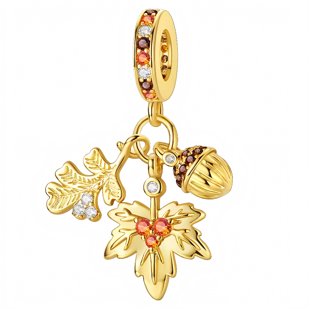 Ce charm raffiné met en valeur l’élégance naturelle de l’automne avec une feuille de chêne délicatement soulignée par des cristaux étincelants et un gland stylisé en métal doré, rehaussé de pierres aux teintes orangées et brunes. Les détails ajourés et la finition lustrée s’inspirent des collections contemporaines qui célèbrent la saison et le retour à la nature. Les touches de cristal et les couleurs chaudes apportent une lumière subtile à chaque mouvement, idéal pour composer un bracelet chaleureux et sop