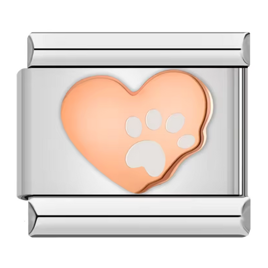 Ce charm italien en acier inoxydable argenté présente un cœur rose au centre, décoré d’une délicate patte de chien, symbole d’amour et de complicité avec nos compagnons à quatre pattes. Avec ses détails soignés et sa touche colorée, il apporte une note tendre et affectueuse à votre bracelet. Facile à fixer, il s’adapte parfaitement à nos bracelets composés de 17 maillons extensibles et réglables, convenant à toutes les tailles de poignet. Compatible avec tous nos charms italiens, ce bijou est idéal pour per