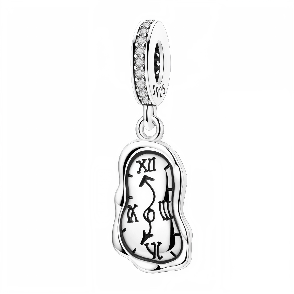 Ajoutez une touche surréaliste et artistique à votre collection avec ce charm inspiré des célèbres montres molles de Salvador Dalí, issues de son œuvre La Persistance de la Mémoire. Ce charm en argent 925 symbolise la fluidité du temps et la créativité sans limites de l’art surréaliste. Parfait pour les amateurs d’art et les esprits audacieux, ce bijou est une véritable déclaration de style et d’imagination.