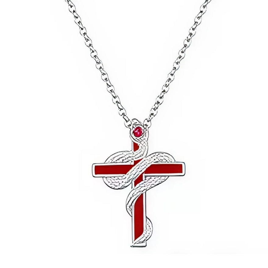 Ce collier en argent 925 présente un pendentif croix moderne, rehaussé d’un émail rouge intense sur les branches, autour duquel s’enroule un serpent texturé en relief. La tête du serpent est mise en valeur par une petite pierre ronde rouge façon cristal, créant un contraste fort entre l’argent lumineux et les touches de rouge.

Caractéristiques :

-Matière : Argent 925/1000 (sterling silver) avec émail rouge brillant et pierre synthétique rouge.
-Design : Croix aux lignes épurées entièrement laquée de rouge